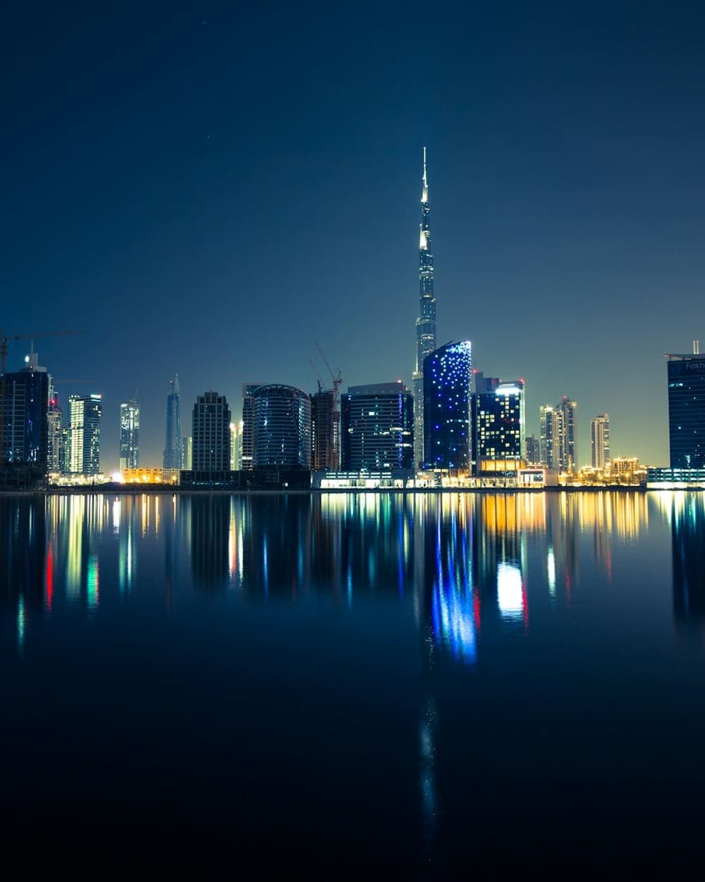 Business Bay skyline reflected in the water at night