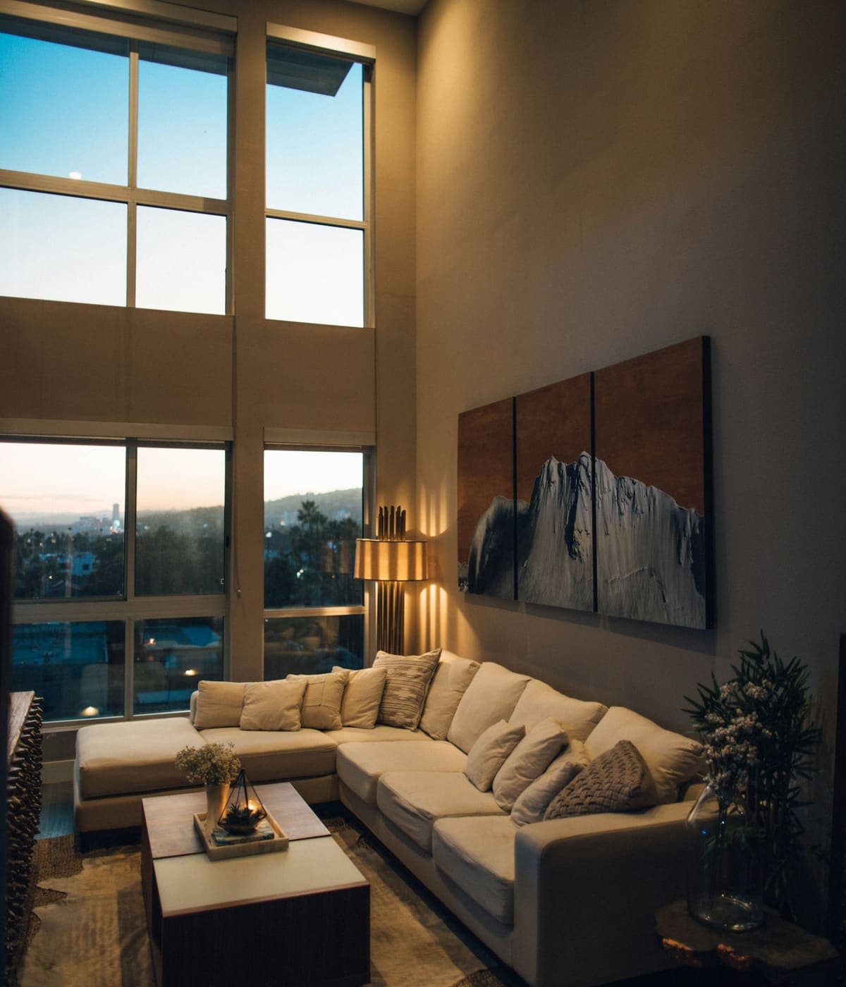 Sunlit living room in a Dubai apartment overlooking the city